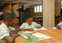 Students of Tema Royal School at the library