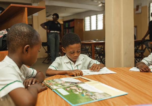 Students of Tema Royal School at the library