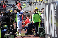 Sulley Muntari left the pitch in protest after being booked for complaining about racism