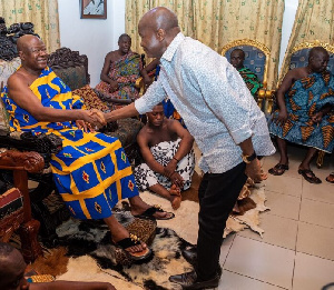 Stephen Ayesu Ntim exchanging pleasantries with a chief