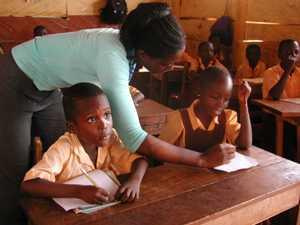 A teacher teaching some pupils