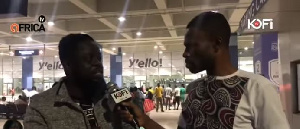 Ofori Amponsah (L) speaking to Kofi Adoma at the airport