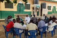 Members of the Muslim community at a social gathering around the mosque