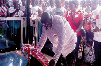 Nana Addo laying a wreath on the tomb of the late Stephen Krakue