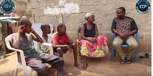 70-year-old Mary Marku with her grandchildren