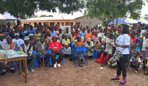 An official of YHFG speaking to the residents