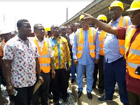 Joe Ghartey and some dignitaries inspecting the rail line