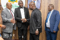 Samuel Jinapor in a handshake with the delegation from Namibia