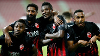 Asamoah Gyan and teammates