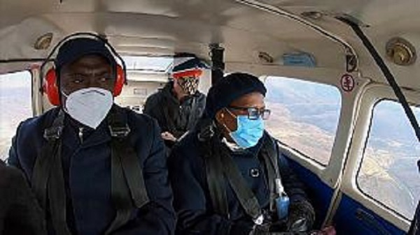 Members of the Lesotho Flying Doctors on a flight to deliver vaccines