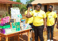 Rita Coffie presenting the items to the Adaase Primary and Junior High School