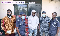 Stonebwoy and his team with some policemen during the presentation