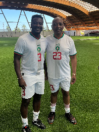 Asamoah Gyan (left) and CAF President Patrice Motspe