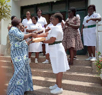 Amanda Cathline presents GHC 20,000.00 cash, to Mrs. Segbefia