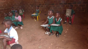 Pupils of Nsesereso K.G learning without chairs in classroom