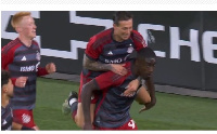 Prince Owusu celebrates with teammates after scoring a stunning goal against New England Revolution