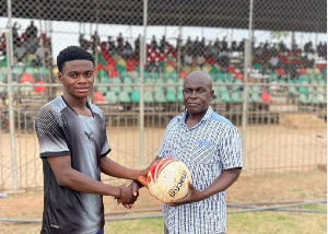 Abdul Osman Safianu receiving the match ball for scoring a hat trick