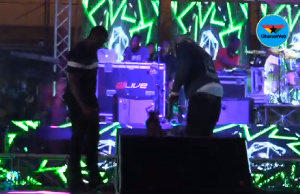 Stonebwoy's manager, Blakk cedi and an event stuff trying to take the fan off stage