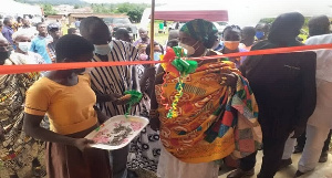 Kwaku Asante-Boateng (in smock) and stakeholders commissioning one of the classroom blocks