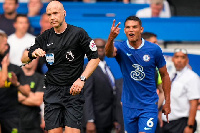 English referee, Anthony Taylor (L)