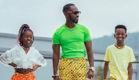 Okyeame Kwame poses with his kids