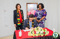 Mayor Martin W.W Horn signing the book of condolence