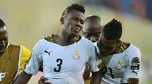 Asamoah Gyan in pain after defeat to Cameroon