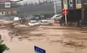 Flooding In Northern China Sweeps Away Cars.png