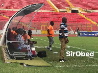 Alhaji Karim Gruzaha seated at the technical bench