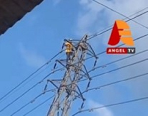 Sena on top of the high-tension pole