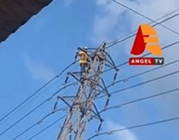 Sena on top of the high-tension pole