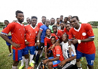 Ghana Black Stars captain Asamoah Gyan with the Liberty team after the game