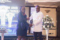 From (R) Corporate Affairs Manager at Vodafone Ghana, Ebenezer Amankwah receiving the award