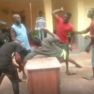 The young man captured being beaten for flouting the chief