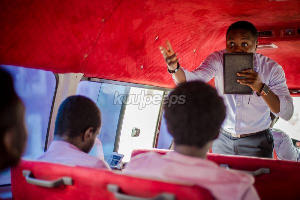 A preacher man sharing the word of God in a trotro (Kuulpeeps photo)