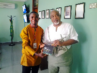 Ajayi Tobi (Author left) with Nigerian High Commissioner, Onafowokan