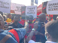 Lawyer Martin Kpebu clad in red (middle)