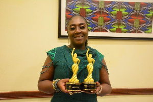 Georgina Asare Fiagbenu showcasing her awards