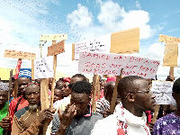 Irate residents of the North East region displaying placards during a protest