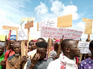 Irate residents of the North East region displaying placards during a protest