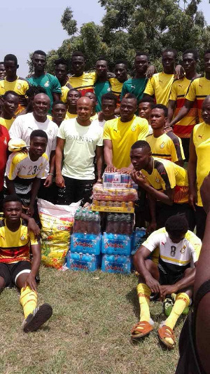 Andre with coach Yaw Preko and some of the players