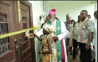 Most Reverend Charles Palmer-Buckle, Catholic Metropolitan Archbishop of Accra cuts the tape to th