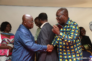 Dr. Anthony Yaw Baah and Nana Akufo-Addo exchange handshake