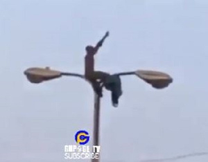 Diehard SM fan captured on the electric pole at Bukom