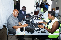 A section of people working on their National Identification Card at a centre