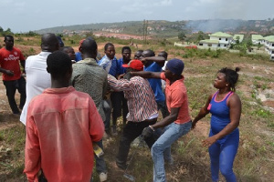 Some persons fighting over a piece land