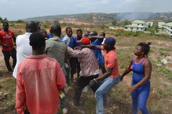 Some persons fighting over a piece land