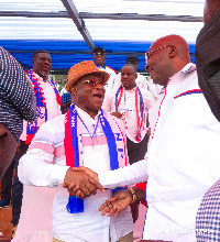 Kyei-Mensah-Bonsu and Dr. Mahamudu Bawumia shaking hands