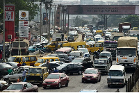 Drivers wait in line to buy fuel at filling station, causing traffic gridlock Lagos' Ibadan expressw