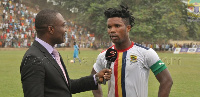 A Supersport official conducting an interview on the pitch